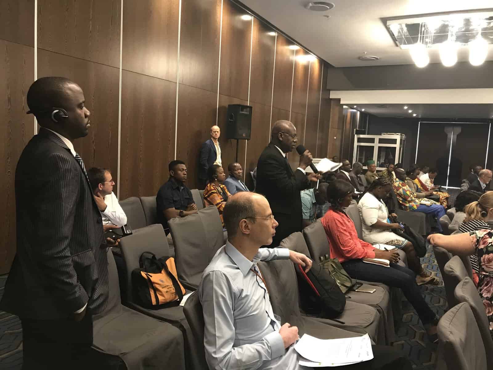 Participants ask questions during panel sessions at AfriGEOSS Symposium
