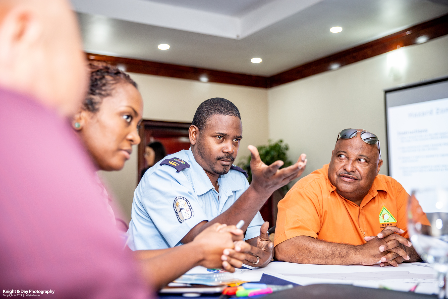 Belize disaster management professionals discuss a mapping exercise at the NDPBA kick off